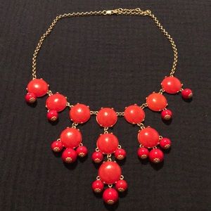 Gold statement bubble necklace with red gems/beads